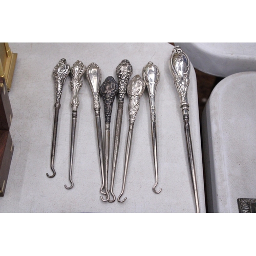 209 - A COLLECTION OF 8 SILVER HALLMARKED BUTTON HOOKS