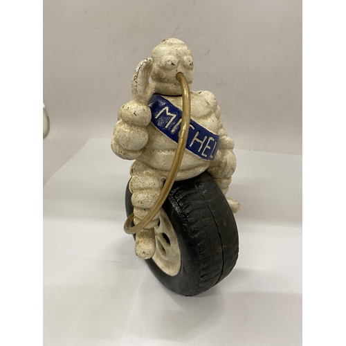 23 - A CAST MICHELIN MAN ON TYRE