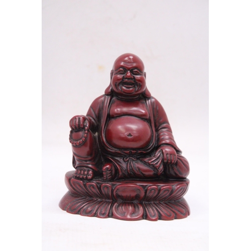 231 - A FIGURE OF A LAUGHING RED BUDDAH