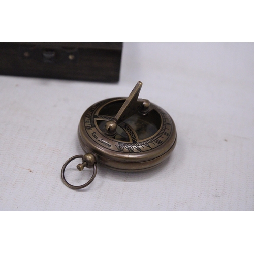 234 - A BOXED BRASS SUNDIAL AND COMPASS