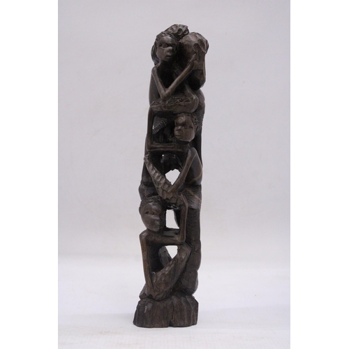 241 - AN AFRICAN HAND CARVED TREE OF LIFE FIGURE, HEIGHT 29CM