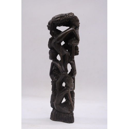 241 - AN AFRICAN HAND CARVED TREE OF LIFE FIGURE, HEIGHT 29CM