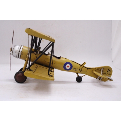 243 - A YELLOW TIN PLATE BI-PLANE