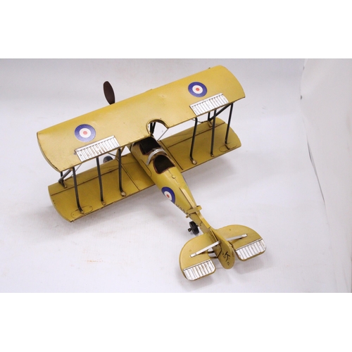 243 - A YELLOW TIN PLATE BI-PLANE