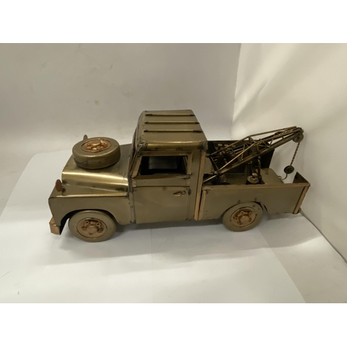 38 - A TIN PLATE LANDROVER TOW TRUCK