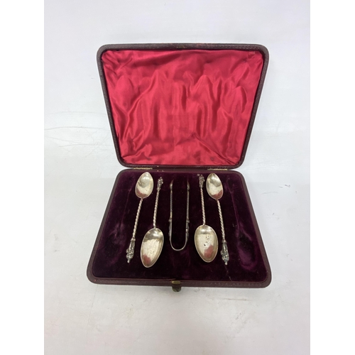 6 - A BOXED SET OF HALLMARKED SILVER BIRMINGHAM APOSTLE SPOONS TOGETHER WITH A SET OF SUGAR CUBE TONGS (... 