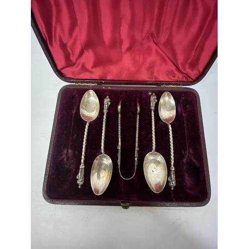 6 - A BOXED SET OF HALLMARKED SILVER BIRMINGHAM APOSTLE SPOONS TOGETHER WITH A SET OF SUGAR CUBE TONGS (... 