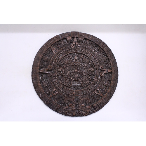 257 - AN ORNAMENTAL AZTEC EMBOSSED WALL PLAQUE