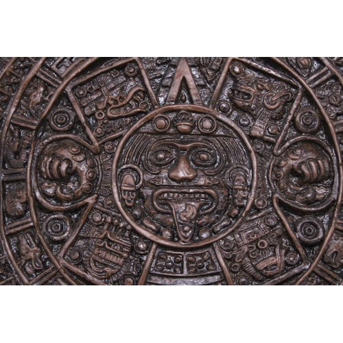 257 - AN ORNAMENTAL AZTEC EMBOSSED WALL PLAQUE