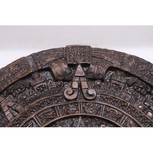 257 - AN ORNAMENTAL AZTEC EMBOSSED WALL PLAQUE