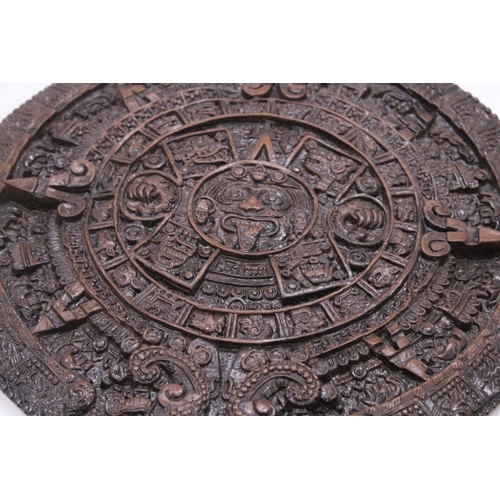 257 - AN ORNAMENTAL AZTEC EMBOSSED WALL PLAQUE