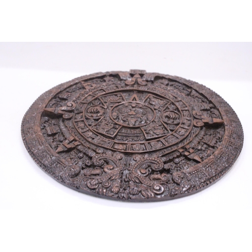 257 - AN ORNAMENTAL AZTEC EMBOSSED WALL PLAQUE