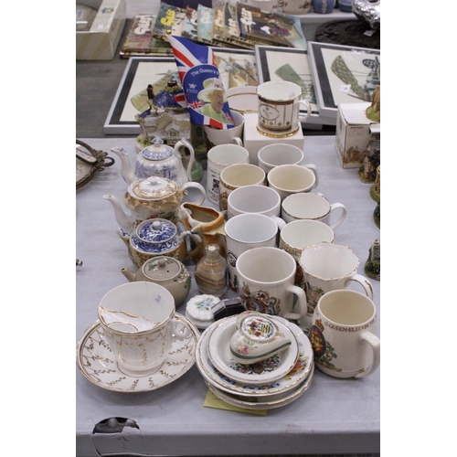 262 - A LARGE QUANTITY OF COLLECTABLES TO INCLUDE COMMEMORATIVE WARE, MOUSTACHE CUP, TEAPOTS, TRINKET POTS... 