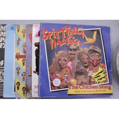 264 - TWELVE COMEDY VINYL SINGLES TO INCLUDE SPITTING IMAGE, BIMBO, HARRY ENFIELD, BARRON KNIGHTS, ETC.,