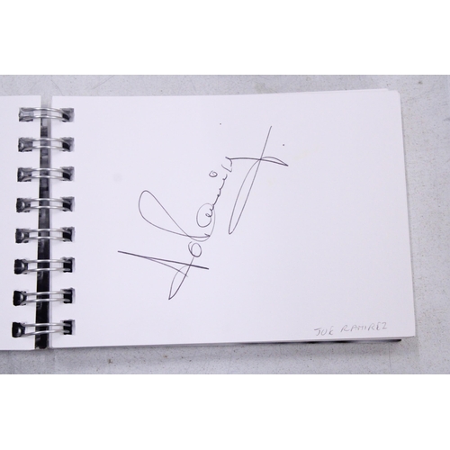 299 - A RACING CAR AUTOGRAPH BOOK TO INCLUDE AUTOGRAPHS FROM LAFFITE, MANSELL, ARNOUX, HAKINNEN, ETC.,