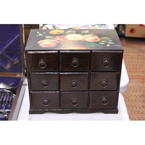 313 - A VINTAGE NINE DRAWER WOODEN JEWELLERY BOX WITH PAINTED FLORAL DESIGN