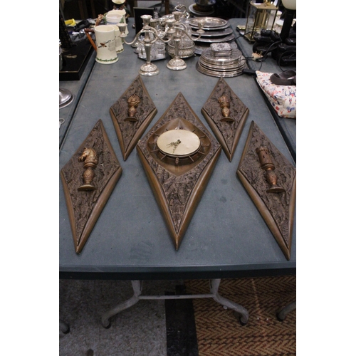 336 - A VINTAGE STYLE WALL CLOCK AND FOUR PLAQUES, IN DIAMOND SHAPED FRAMES WITH CHESS STYLE DECORATION