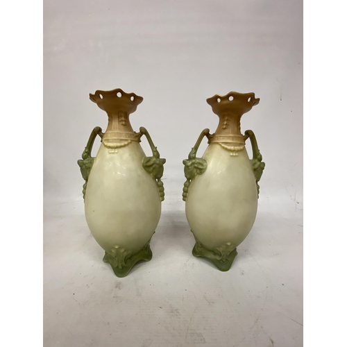 44 - A PAIR OF ANTIQUE VASES WITH TWIN HANDLES IN THE SHAPE OF GOATS DEPICTING SCHNAUZER DOGS - 30.5 CM