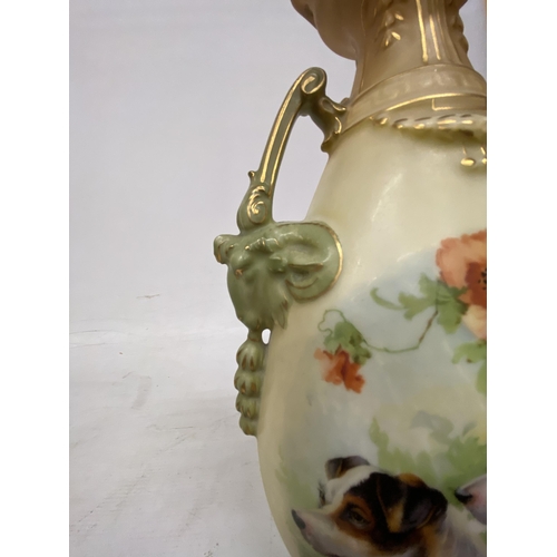 44 - A PAIR OF ANTIQUE VASES WITH TWIN HANDLES IN THE SHAPE OF GOATS DEPICTING SCHNAUZER DOGS - 30.5 CM