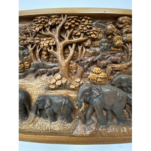 50 - A CARVED BALINESE WOODEN PANEL WITH THREE DIMENSIONAL WORK OF ART - APPROX 142 X 49 CM