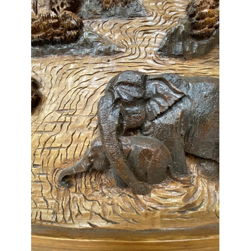 50 - A CARVED BALINESE WOODEN PANEL WITH THREE DIMENSIONAL WORK OF ART - APPROX 142 X 49 CM