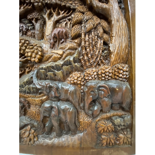 51 - TWO CARVED BALINESE WOODEN PANELS WITH THREE DIMENSIONAL WORK OF ART - APPROX 70 X 49.5 CM