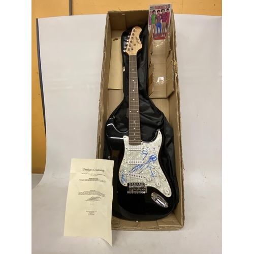 74 - A ONE DIRECTION SIGNED GUITAR SIGNED BY ALL FIVE MEMBERS OF THE BAND INCLUDING HARRY STYLES WITH CER... 