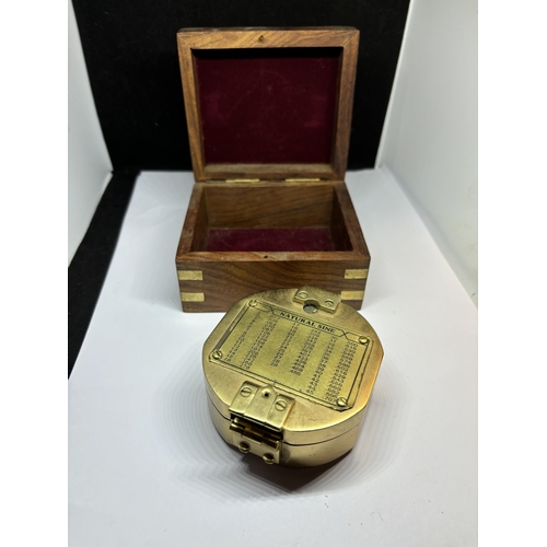 131 - A BRASS NAUTICAL COMPASS WITH SPIRIT LEVEL COMPLETE WITH WOODEN CASE