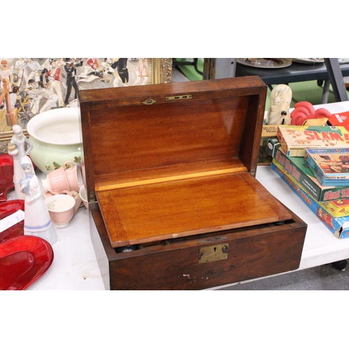 999 - A MAHOGANY WRITING SLOPE WITH INKWELLS