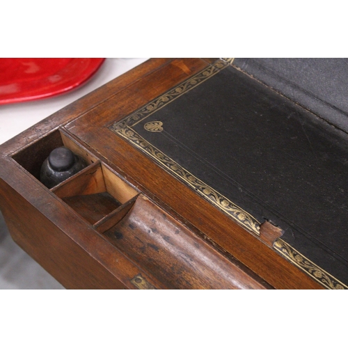 999 - A MAHOGANY WRITING SLOPE WITH INKWELLS