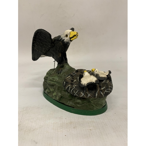 116 - A CAST IRON EAGLE AND EAGLET MECHANICAL COIN BANK