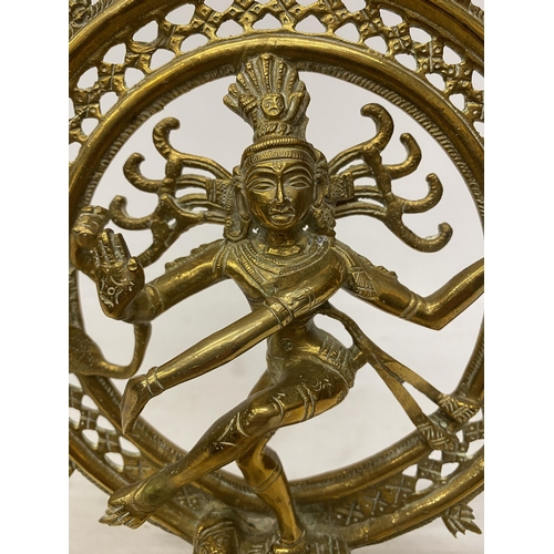 12 - A NATARAJA BRASS SCULPTURE EMBODYING THE COSMIC DANCE OF CREATION AND DESTRUCTION WITH MESMERISING A... 