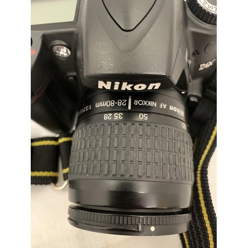 122 - A NIKON D90 CAMERA WITH A 50MM LENS