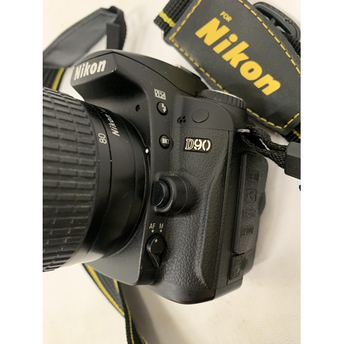 122 - A NIKON D90 CAMERA WITH A 50MM LENS