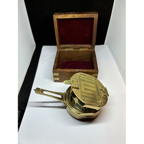 131 - A BRASS NAUTICAL COMPASS WITH SPIRIT LEVEL COMPLETE WITH WOODEN CASE