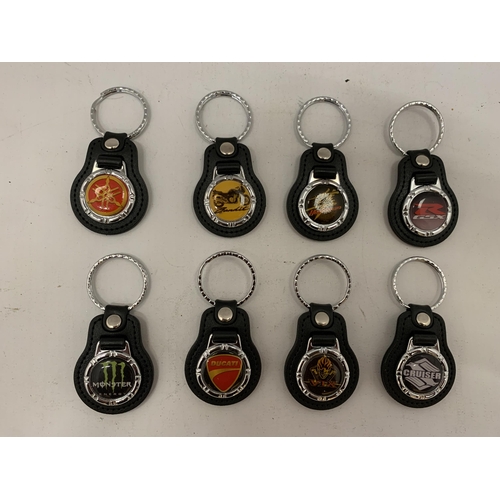 140 - A COLLECTION OF MOTORCYCLE KEY RINGS TO INCLUDE SUZUKI CRUISER, BANDIT, MONSTER, DUCATI 2, ETC.,