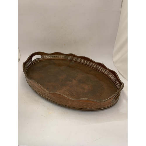 142 - A SCALLOPED EDGED COPPER TRAY