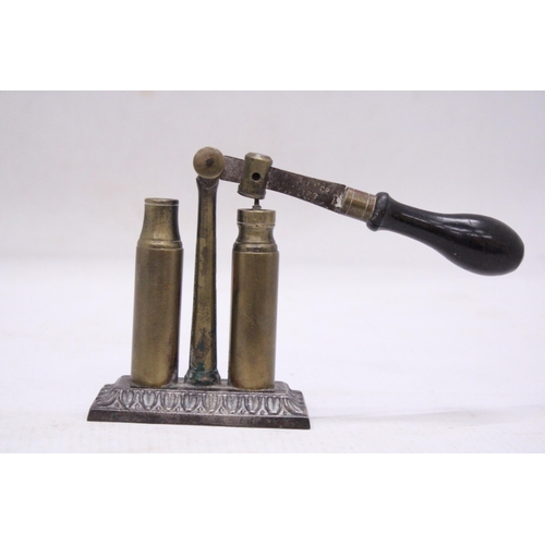 205 - AN UNUSUAL VINTAGE BRASS BULLET CAP SEALER