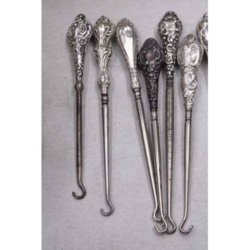 209 - A COLLECTION OF 8 SILVER HALLMARKED BUTTON HOOKS