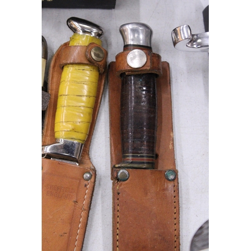 224 - THREE VINTAGE DAGGERS IN LEATHER SHEATHS