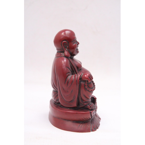 231 - A FIGURE OF A LAUGHING RED BUDDAH