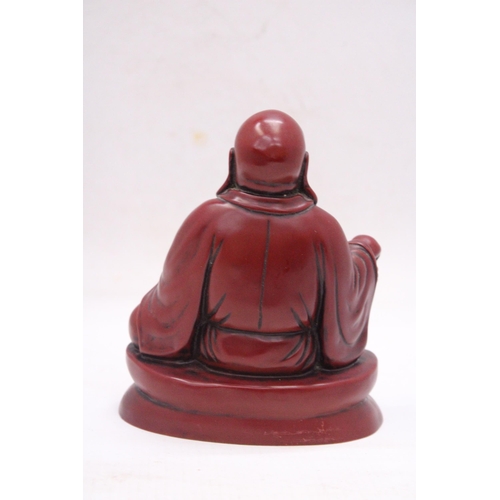 231 - A FIGURE OF A LAUGHING RED BUDDAH