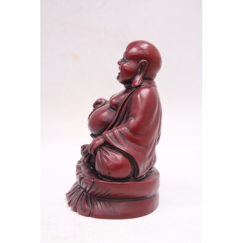 231 - A FIGURE OF A LAUGHING RED BUDDAH