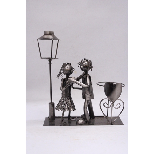 236 - A DANCING DUO METAL WINE BOTTLE HOLDER