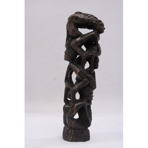 241 - AN AFRICAN HAND CARVED TREE OF LIFE FIGURE, HEIGHT 29CM