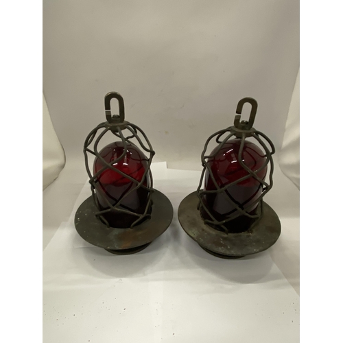 37 - A PAIR OF COASTAL NAUTICAL MARINE LIGHTS IN A BRASS CAGE