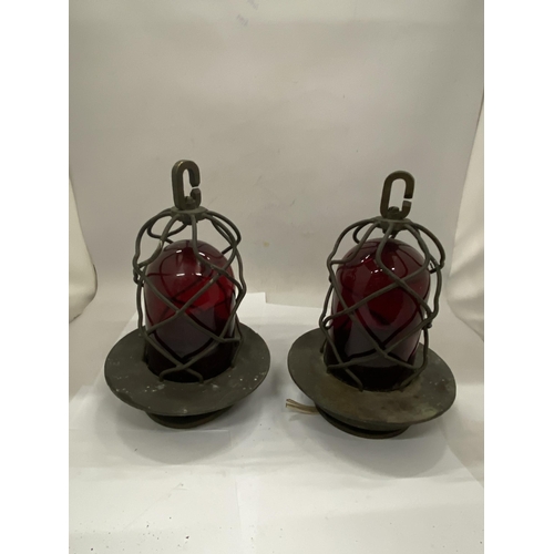 37 - A PAIR OF COASTAL NAUTICAL MARINE LIGHTS IN A BRASS CAGE