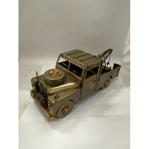 38 - A TIN PLATE LANDROVER TOW TRUCK