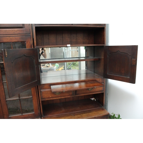 2809 - A RANGE OF FOUR OAK LOUNGE UNITS TO INCLUDE GLAZED BOOKCASE, BUREAU AND COCKTAIL SECTION ENCLOSING F... 