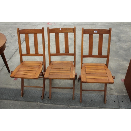 2810 - THREE MID 20TH CENTURY FOLDING PATIO CHAIRS